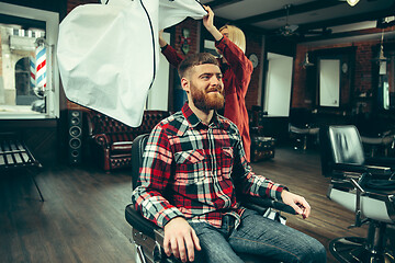 Image showing Client during beard shaving in barber shop