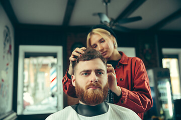 Image showing Client during beard shaving in barber shop