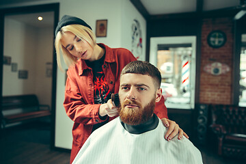Image showing Client during beard shaving in barber shop