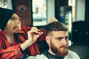 Image showing Client during beard shaving in barber shop