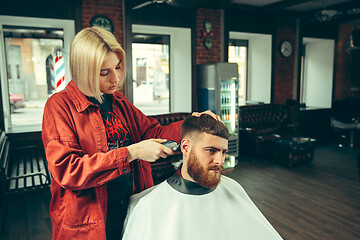 Image showing Client during beard shaving in barber shop