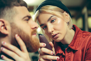 Image showing Client during beard shaving in barber shop