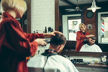 Image showing Client during beard shaving in barber shop