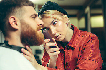 Image showing Client during beard shaving in barber shop