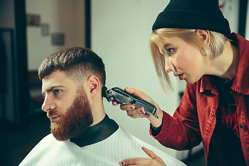 Image showing Client during beard shaving in barber shop