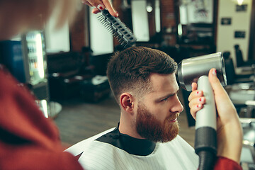 Image showing Client during beard shaving in barber shop