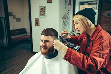 Image showing Client during beard shaving in barber shop