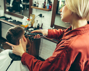 Image showing Client during beard shaving in barber shop