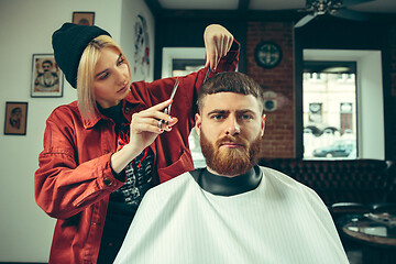 Image showing Client during beard shaving in barber shop