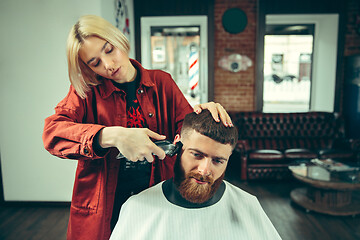 Image showing Client during beard shaving in barber shop