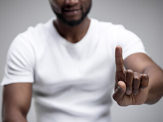 Image showing Businessman hand touching empty virtual screen