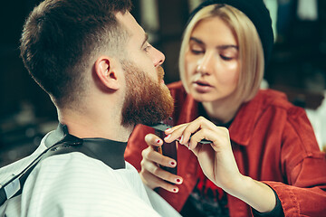 Image showing Client during beard shaving in barber shop