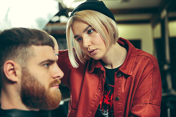 Image showing Client during beard shaving in barber shop