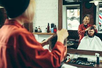 Image showing Client during beard shaving in barber shop