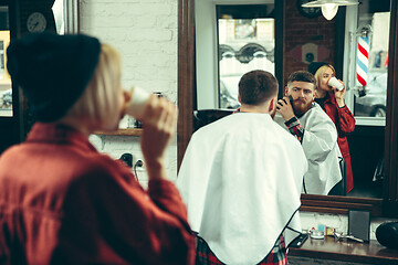 Image showing Client during beard shaving in barber shop