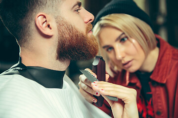 Image showing Client during beard shaving in barber shop