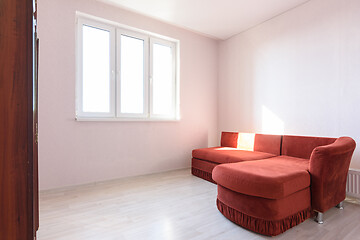 Image showing Interior of a bright room with an old sofa in the bedroom