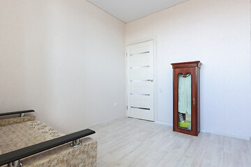 Image showing The interior of a modest small bedroom with very poor furniture