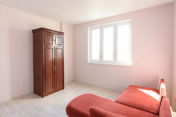 Image showing Interior of a non-residential room empty for sale with several pieces of furniture
