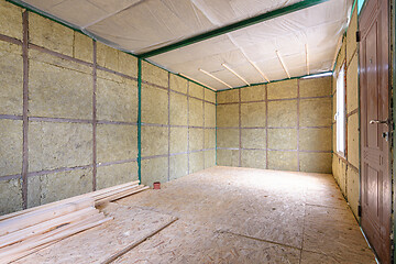 Image showing The interior of a suburban room under construction, insulated from the inside with soft thermal insulation