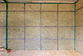 Image showing Wall of a frame house from the inside insulated with mineral wool