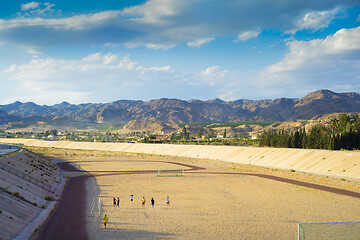 Image showing ANDALUSIA, SPAIN - APRIL 24, 2014: A football field on the mountain s on tha background.