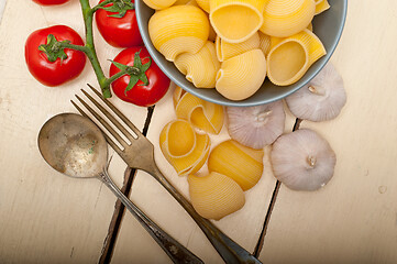 Image showing Italian snail lumaconi pasta with tomatoes