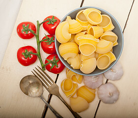 Image showing Italian snail lumaconi pasta with tomatoes