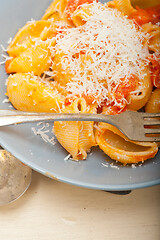 Image showing Italian snail lumaconi pasta with tomatoes