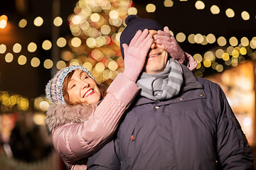 Image showing happy senior couple at christmas market