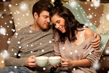 Image showing happy couple drinking hot chocolate on christmas