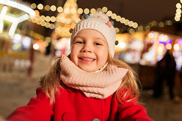 Image showing little girl taking selfie at christmas market