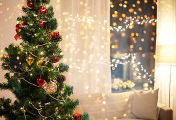 Image showing close up of christmas tree at home in evening