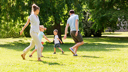 Image showing happy family playing at summer park