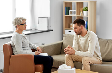 Image showing senior woman psychologist and young man patient