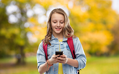 Image showing teen student girl with school bag and smartphone