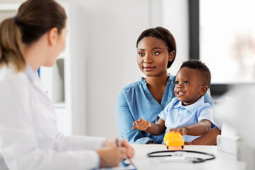 Image showing happy mother with baby son and doctor at clinic