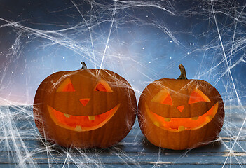 Image showing two pumpkins or jack o lanterns and spiderweb