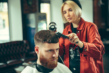 Image showing Client during beard shaving in barber shop