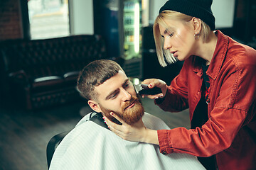 Image showing Client during beard shaving in barber shop