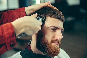 Image showing Client during beard shaving in barber shop