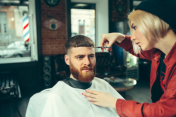 Image showing Client during beard shaving in barber shop