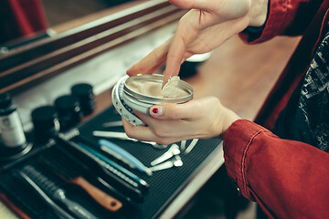 Image showing Female barber in barber shop