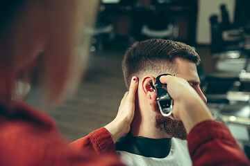 Image showing Client during beard shaving in barber shop