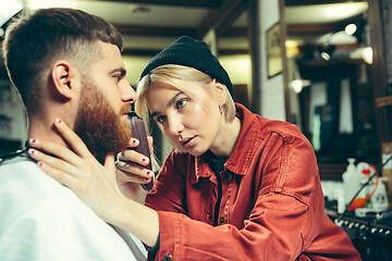 Image showing Client during beard shaving in barber shop