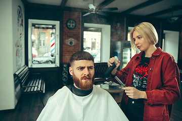 Image showing Client during beard shaving in barber shop