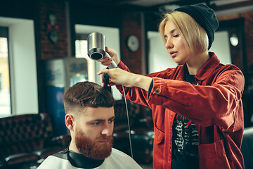 Image showing Client during beard shaving in barber shop