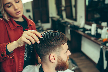 Image showing Client during beard shaving in barber shop