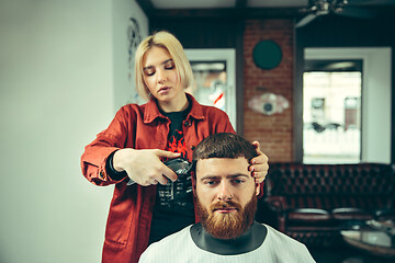 Image showing Client during beard shaving in barber shop