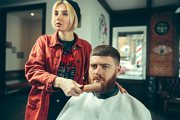 Image showing Client during beard shaving in barber shop